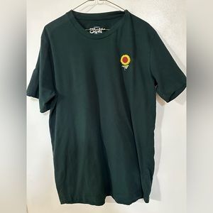 This is a green Men’s Eighty eight t-shirt with a Sunflower on the left front.